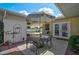 Outdoor patio space with furniture, white privacy fence, and view of the backyard at 2708 27Th Avenue W Dr, Bradenton, FL 34205