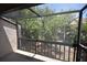 Serene screened-in balcony with a peaceful view of the surrounding greenery at 2729 Hidden Lake Blvd # D, Sarasota, FL 34237