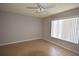 Bedroom with tile flooring and a window with white blinds at 2729 Hidden Lake Blvd # D, Sarasota, FL 34237