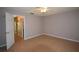 Neutral bedroom with a ceiling fan and access to the main areas of the house at 2729 Hidden Lake Blvd # D, Sarasota, FL 34237