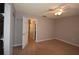 Bedroom with tile flooring and view into the bathroom and entry hallway at 2729 Hidden Lake Blvd # D, Sarasota, FL 34237