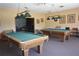 Spacious game room features two billiard tables and a comfortable lounge area at 2729 Hidden Lake Blvd # D, Sarasota, FL 34237