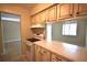 Kitchen with oven and range and bar top seating at 2729 Hidden Lake Blvd # D, Sarasota, FL 34237