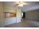 Inviting living room with tile flooring, open layout to kitchen, and a ceiling fan at 2729 Hidden Lake Blvd # D, Sarasota, FL 34237