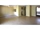 Open living space with neutral walls and tile flooring at 2729 Hidden Lake Blvd # D, Sarasota, FL 34237