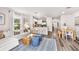 Open-concept living space featuring luxury vinyl plank flooring and modern decor at 2747 Newbern Banks Dr, Bradenton, FL 34208