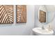 Elegant powder room featuring modern vanity and decor at 2751 Newbern Banks Dr, Bradenton, FL 34208