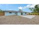 View of the backyard with a brick paver patio and a wood fence at 2825 Pinecrest St, Sarasota, FL 34239