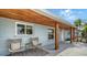 Inviting front porch featuring a seating area with stylish chairs and attractive design elements at 2825 Pinecrest St, Sarasota, FL 34239