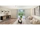 Relaxing living room with sliding glass doors to a patio, modern decor, and ample natural light at 2825 Pinecrest St, Sarasota, FL 34239