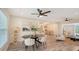 Open-concept living and dining area with modern furnishings and light wood-look floors at 2825 Pinecrest St, Sarasota, FL 34239
