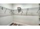 Walk-in closet with white walls and wire rack shelves and hardwood flooring at 2825 Pinecrest St, Sarasota, FL 34239