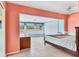 A spacious bedroom featuring tile flooring, neutral tones, and large windows at 3432 Pine Valley Dr, Sarasota, FL 34239
