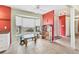 Bright kitchen nook featuring large windows, tile flooring, and playroom adjacent to the kitchen at 3432 Pine Valley Dr, Sarasota, FL 34239