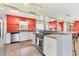 Well-equipped kitchen with updated appliances, tile flooring, and ample counter space at 3432 Pine Valley Dr, Sarasota, FL 34239