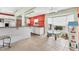 Kitchen with breakfast bar, white cabinetry, and a dining nook with a bay window at 3432 Pine Valley Dr, Sarasota, FL 34239