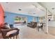 Spacious living room featuring tile flooring, and sliding glass doors to a screened-in patio at 3432 Pine Valley Dr, Sarasota, FL 34239