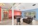 Bright living room with tile floors and a sliding glass door that opens onto a covered patio at 3432 Pine Valley Dr, Sarasota, FL 34239
