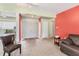 Spacious living room featuring tile flooring, double doors, and neutral wall colors at 3432 Pine Valley Dr, Sarasota, FL 34239