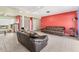 Open-concept living area with tile flooring, ceiling fan, and stylish furnishings at 3432 Pine Valley Dr, Sarasota, FL 34239