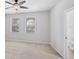 Bright bedroom with ceiling fan and two windows at 3760 82Nd Avenue E Cir # 102, Sarasota, FL 34243