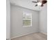 Bedroom with carpet, natural light from the window, and a ceiling fan provides comfort at 3760 82Nd Avenue E Cir # 102, Sarasota, FL 34243
