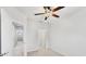 Bright bedroom with a ceiling fan and neutral carpet offers a comfortable and inviting space at 3760 82Nd Avenue E Cir # 102, Sarasota, FL 34243