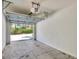 Spacious two-car garage with an open door, providing ample parking and storage at 3760 82Nd Avenue E Cir # 102, Sarasota, FL 34243