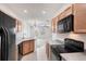 Bright kitchen with stainless steel appliances and an open layout to the living area at 3760 82Nd Avenue E Cir # 102, Sarasota, FL 34243