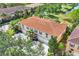 Lovely aerial view of multi-Gathering townhouse with a beautiful tile roof, garages, and mature landscaping at 3760 82Nd Avenue E Cir # 102, Sarasota, FL 34243