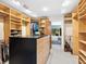 Walk-in closet provides ample storage space, built-in shelving, drawers, and center island at 3905 Country View Dr, Sarasota, FL 34233