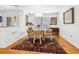 Cozy dining area featuring a round glass table and decorative rug at 3905 Country View Dr, Sarasota, FL 34233