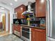 This kitchen features high-end stainless steel appliances and dark countertops for a sleek, modern look at 3905 Country View Dr, Sarasota, FL 34233