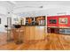 Modern kitchen with breakfast bar, dark countertops, and stainless steel appliances at 3905 Country View Dr, Sarasota, FL 34233