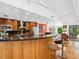 Contemporary kitchen with breakfast bar, modern fixtures, and plenty of storage space at 3905 Country View Dr, Sarasota, FL 34233