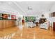 Spacious living area with vaulted ceilings, hardwood floors, and a modern fireplace at 3905 Country View Dr, Sarasota, FL 34233