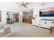 This spacious living room features modern decor, access to other rooms, and is great for entertaining guests at 3905 Country View Dr, Sarasota, FL 34233