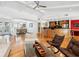 Large living area with hardwood floors, breakfast bar, and open to dining area at 3905 Country View Dr, Sarasota, FL 34233