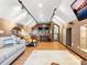 Bright living room with wood floors, track lighting, a comfortable couch and a cozy reading nook with an adjustable armchair at 3905 Country View Dr, Sarasota, FL 34233