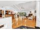 Bright open-concept living area with hardwood floors, modern fireplace, and access to outdoor patio at 3905 Country View Dr, Sarasota, FL 34233