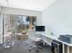 Bright home office space with large window and view of lush backyard at 3905 Country View Dr, Sarasota, FL 34233