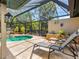 A screened pool area features a lounge area, blending indoor comfort with outdoor enjoyment and unobstructed views at 3905 Country View Dr, Sarasota, FL 34233