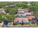 An aerial view displays the layout of the community, featuring well-maintained landscaping and screened in pools at 3919 Glen Oaks Manor Dr, Sarasota, FL 34232