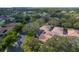Overhead view of a residential neighborhood featuring private pools and lush landscaping in a serene setting at 3919 Glen Oaks Manor Dr, Sarasota, FL 34232