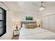 This bedroom is brightly illuminated by a ceiling fan and lots of natural light at 3919 Glen Oaks Manor Dr, Sarasota, FL 34232