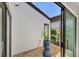 Outdoor courtyard with gravel, a potted plant, and an exterior window at 3919 Glen Oaks Manor Dr, Sarasota, FL 34232