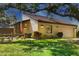 Inviting single-story home boasts lush landscaping, covered entry, and an attached garage at 3919 Glen Oaks Manor Dr, Sarasota, FL 34232