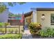 Charming home featuring well-maintained landscaping, an American flag, and a welcoming entryway at 3919 Glen Oaks Manor Dr, Sarasota, FL 34232