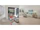 Cozy living area offers seating and a sliding door to an outdoor space at 3919 Glen Oaks Manor Dr, Sarasota, FL 34232