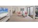 Comfortable living room featuring neutral decor, plush seating, and easy access to an outdoor area at 3919 Glen Oaks Manor Dr, Sarasota, FL 34232